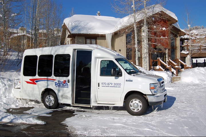 A complimentary shuttle awaits to whisk you from the snow-dusted property to nearby slopes and town, ensuring effortless winter adventures.