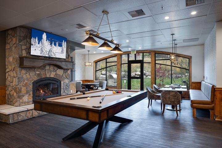Unwind in this inviting lounge with a game of billiards by the fireplace, or relax with a view of the surrounding landscape through elegant windows.