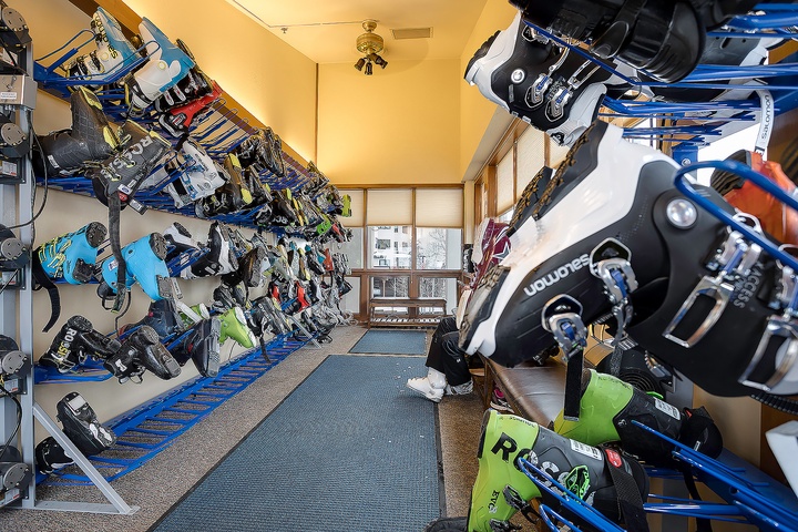 A dedicated ski and snowboard storage room keeps your winter gear organized and ready for the slopes, with ample space for equipment and boots.