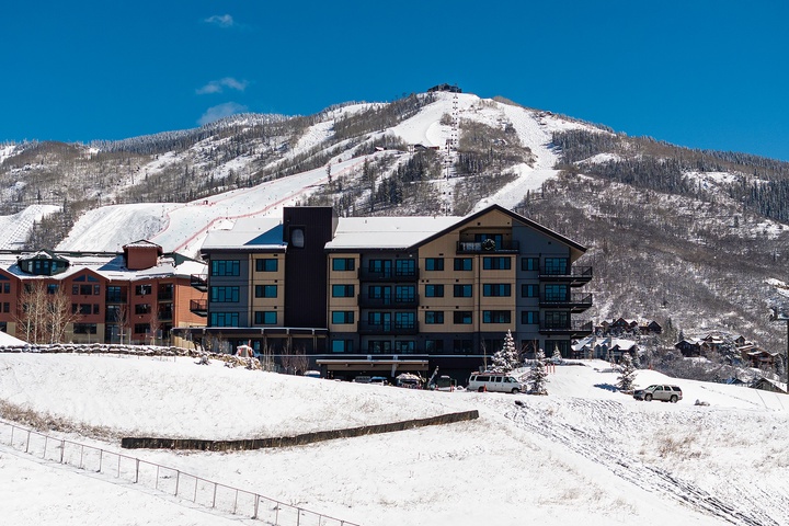 Nestled at the base of pristine ski slopes, your mountain retreat offers direct access to powdery runs and breathtaking alpine views.