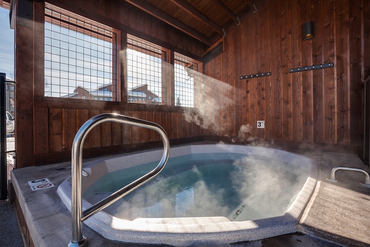Soak away your day in this private hot tub, where warm, soothing water and mountain views create your perfect après-ski retreat.