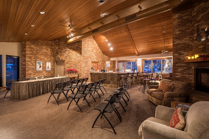 A versatile gathering space combines rustic brick warmth with modern comfort, featuring flexible seating arrangements perfect for your group meetings or celebrations.