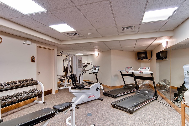 Stay active during your getaway in this well-equipped fitness center featuring treadmills, free weights, and strength training equipment to maintain your wellness routine.
