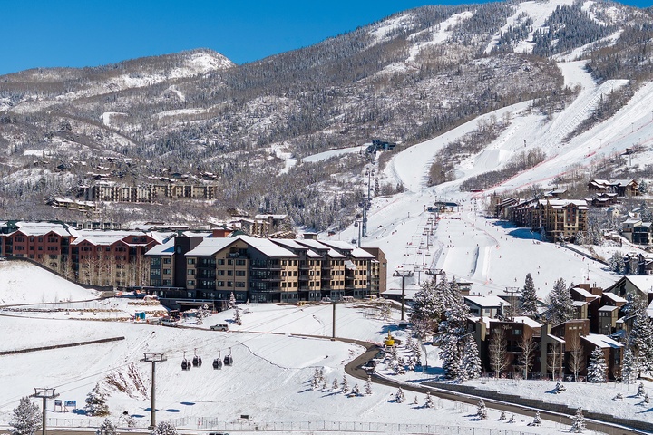A stunning ski-in/ski-out mountain resort set against pristine slopes and spectacular alpine scenery, offering direct access to winter adventures and breathtaking mountain vistas.