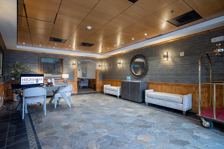 A modern lobby welcomes you with warm wood accents, elegant lighting, and comfortable seating areas for relaxing while you check in.