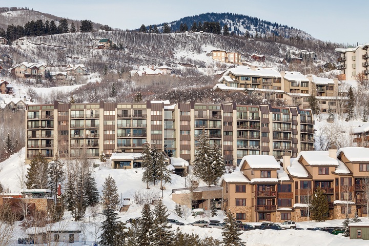 Ski-in ski-out convenience in a picturesque winter village surrounded by snow-covered slopes and mountain peaks.