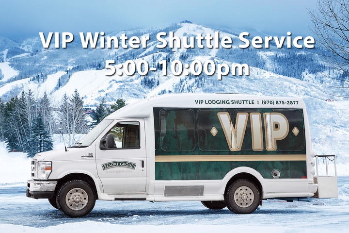 A VIP shuttle service stands ready in a snowy mountain resort area during the winter season, providing convenient transport to nearby ski slopes.