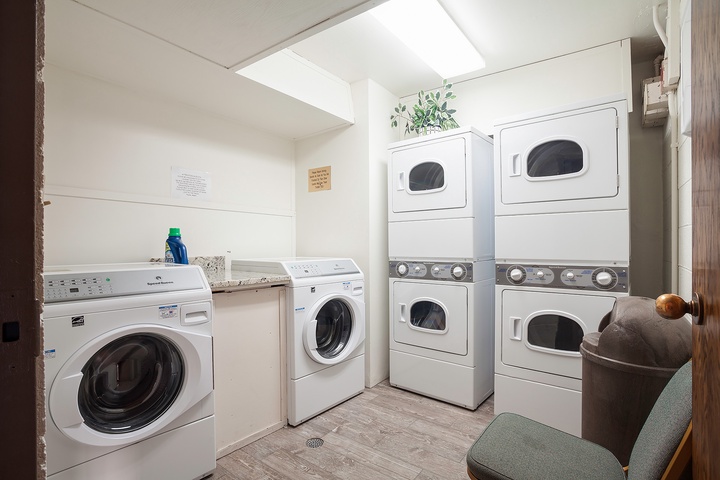 A well-equipped shared laundry room with multiple washers and dryers makes it easy to refresh your wardrobe during your stay.