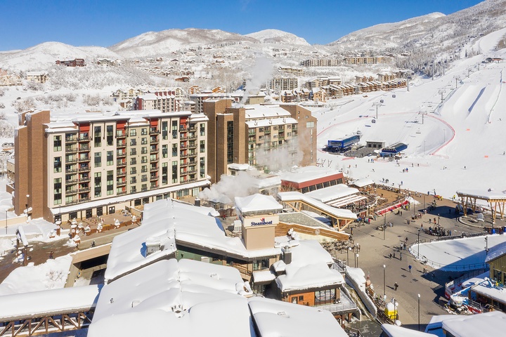 Nestled in a pristine mountain valley, this winter resort offers direct access to world-class skiing, cozy alpine lodging, and vibrant village amenities all blanketed in fresh snow.