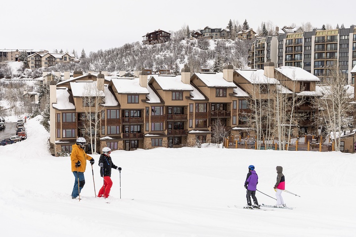 Ski-in/ski-out property with slopeside access, nestled in a winter mountain village surrounded by stunning alpine scenery and fresh powder.