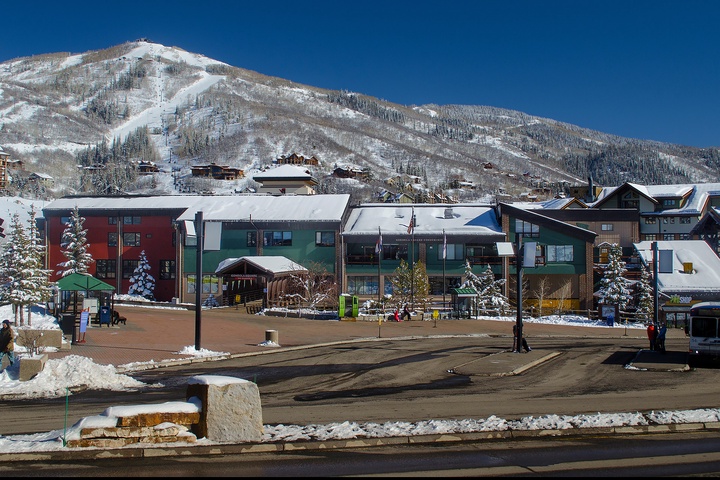 Winter mountain town with snow-covered peaks and colorful buildings near the property, offering a scenic alpine setting for ski season adventures.