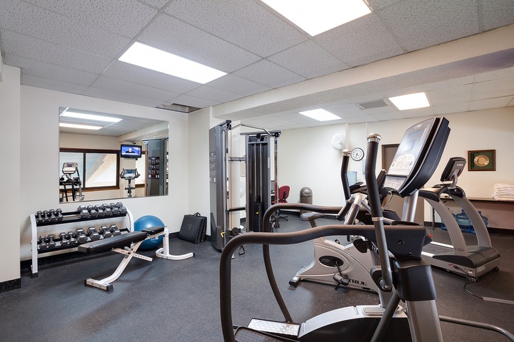 Your fully equipped fitness center awaits with cardio machines, free weights, and cable systems—perfect for maintaining your workout routine while away from home.