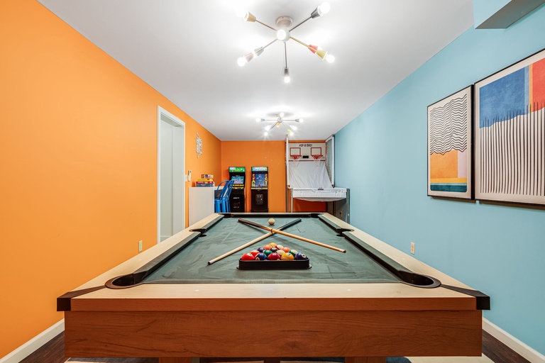 Challenge friends to pool while arcade games await your turn in this vibrant entertainment space.