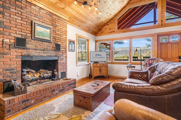 Living Area w/ Gas Fireplace & Mountain Views