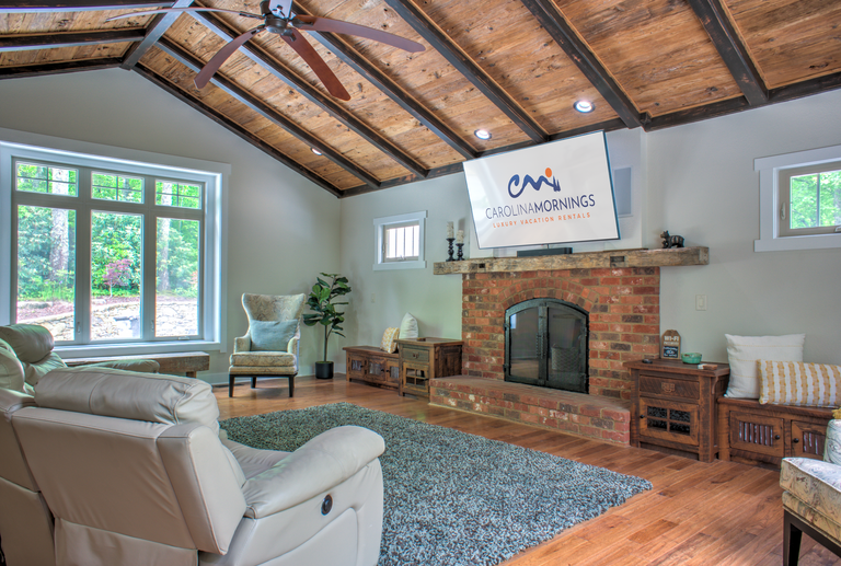 Main Level - Living Area w/ Wood Fireplace & Smart TV
