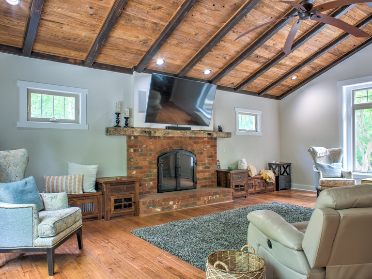 Gather Under the Vaulted Ceilings by the Wood Fireplace
