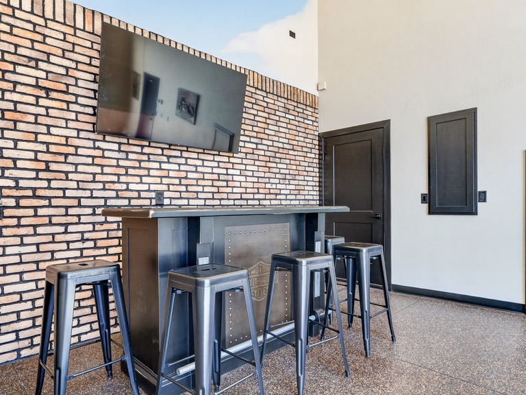 The huge garage also has bar top and TV perfect for hanging out after a long day on the water!