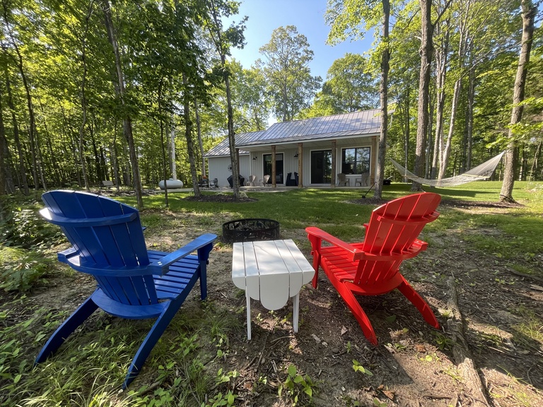 Firepit offers seating for 6 (4 adirondack chairs from front porch + 2 folding) and wood for guest use