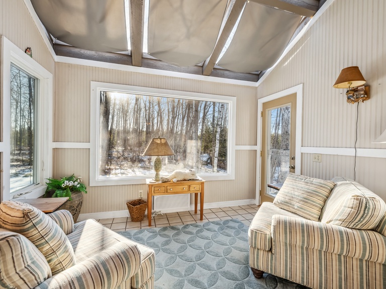 Sunporch off the living room with lovely views of the yard