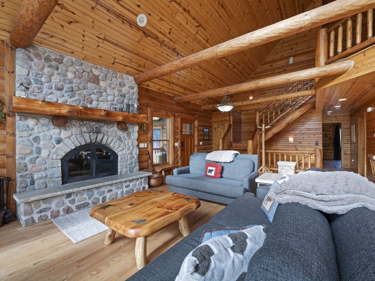 open concept entryway and wood fireplace