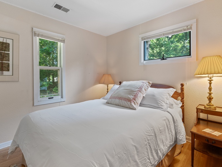 Bedroom 1 on main level includes a queen size bed