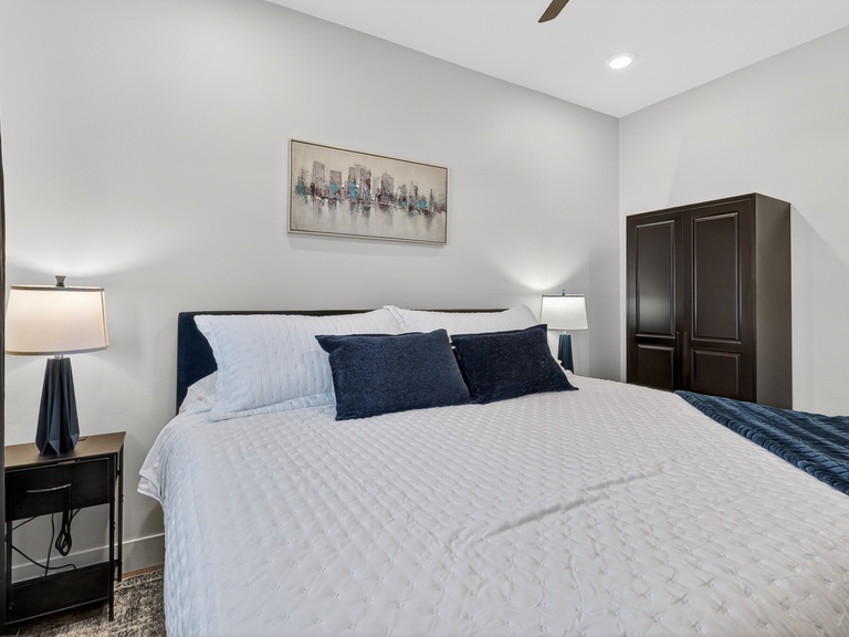 Lower unit: Bedroom 1- King size bed, TV, and Ceiling Fan