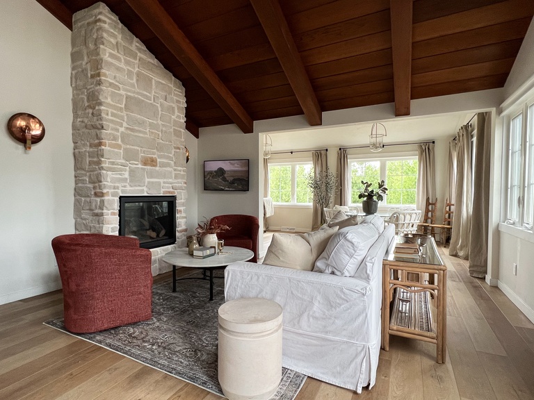 Main living space includes a Samsung Frame TV, gas fireplace and plenty of comfortable seating