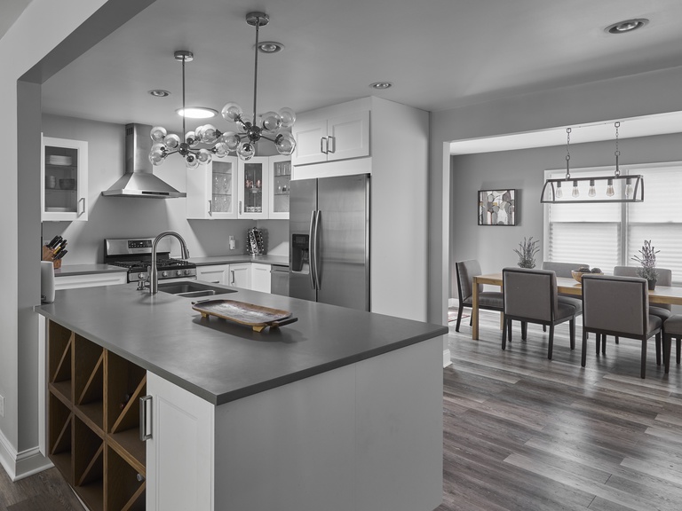 Gather around the island in the beautiful, stocked kitchen