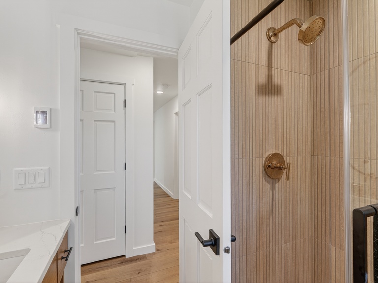Gorgeous remodeled bathroom with walk in shower. Threshold into shower is low :)