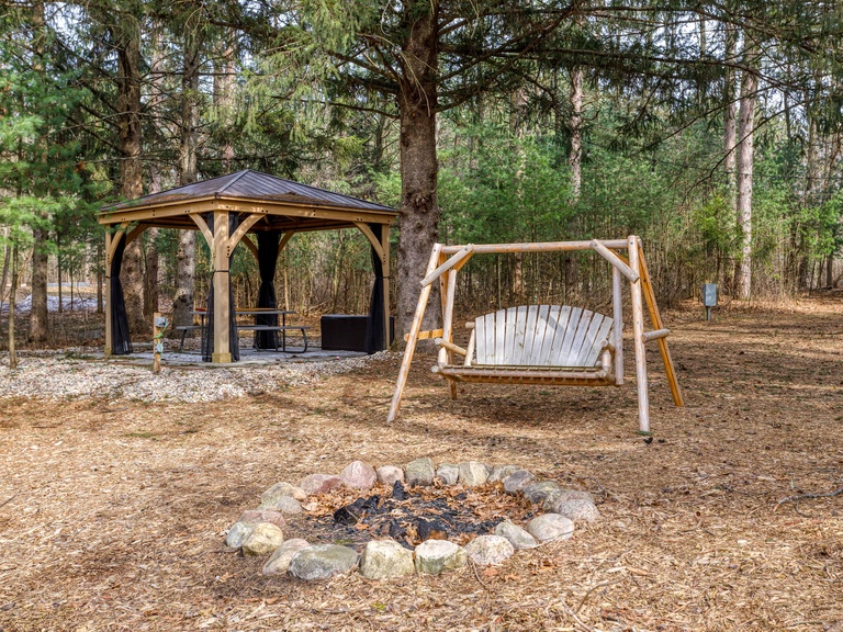 Enjoy a relaxing bonfire or sit under the covered cabana!