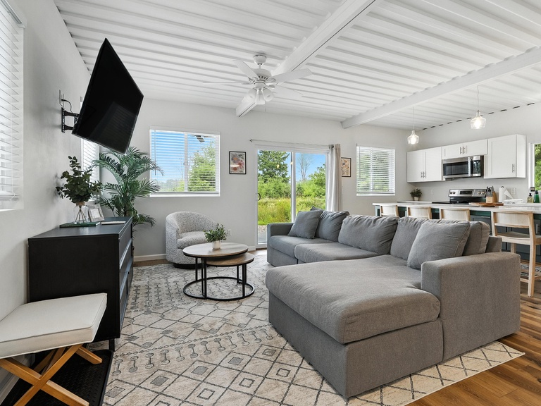 Smart TV in living room with Amazon Fire TV Stick. Guests may log in to streaming devices using their own accounts.