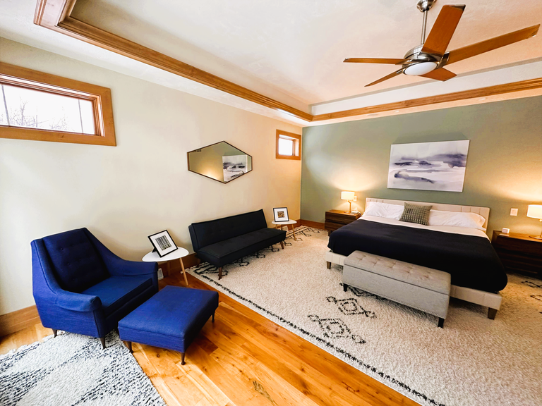 Bedroom #1 (upper level) includes a king size bed (with Purple, medium firmness mattress), full size sleeper sofa, ceiling fan and TV