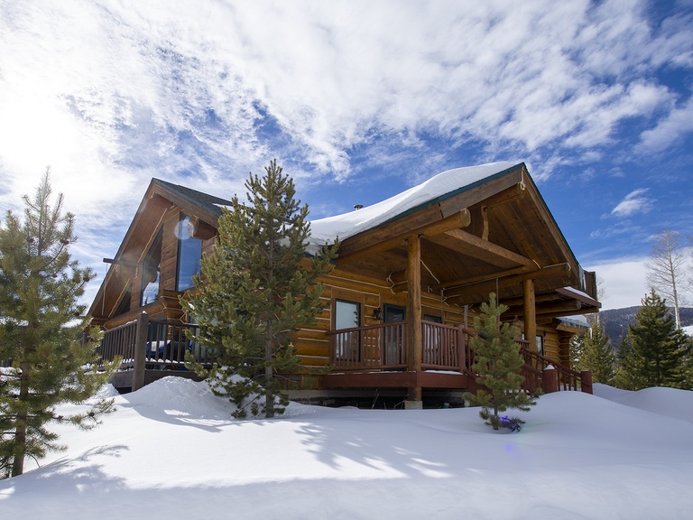 Miles Behind Log Cabin