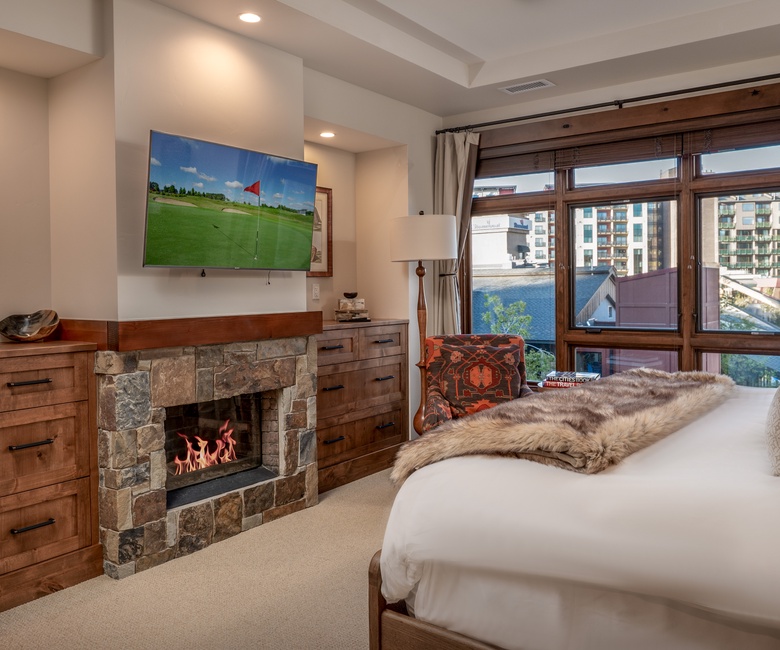 Bedroom 1, Main Level - Primary king bedroom with fireplace and TV
