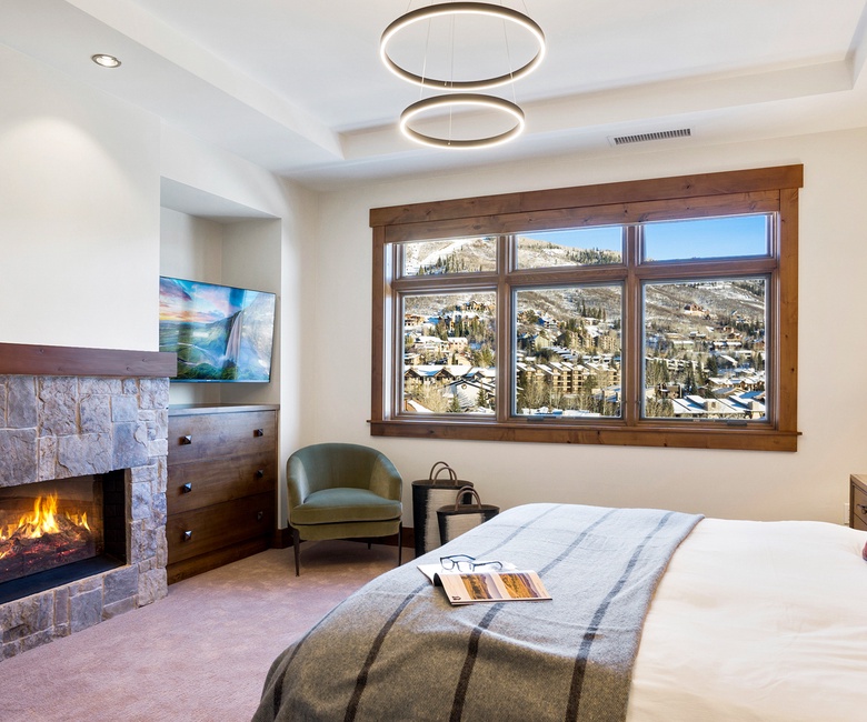 Bedroom 1, Main Level - Primary suite with fireplace and TV