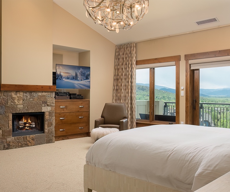 Bedroom 1, Main Level - Primary king bedroom with fireplace and TV