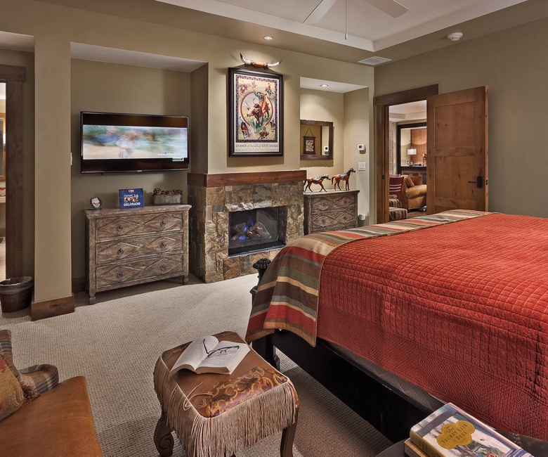 Bedroom 1, Main Level - Primary king suite with fireplace and TV