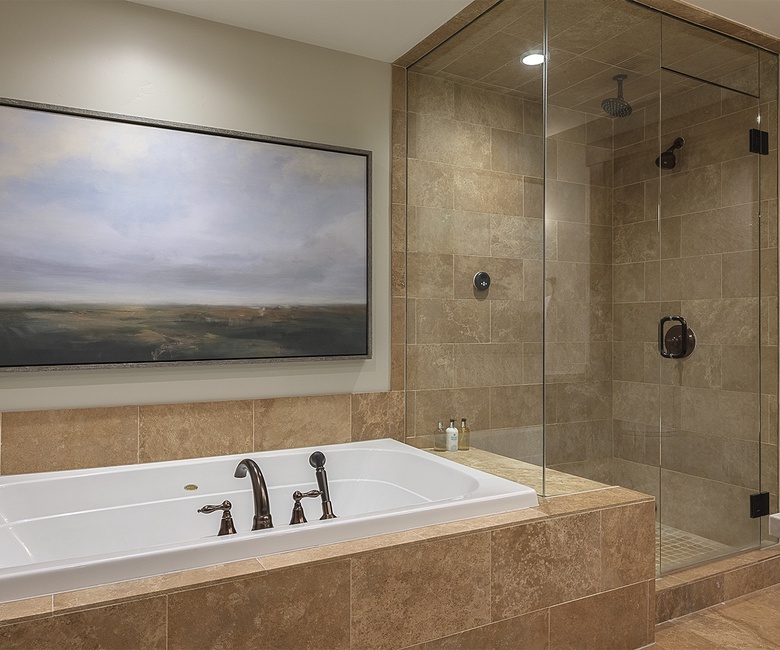 Bedroom 1, Main Level - Primary ensuite with soaking tub and separate shower