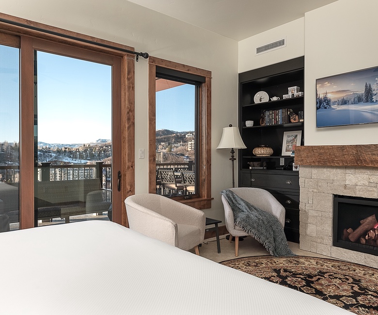 Bedroom 1, Main Level - Primary king suite fireplace