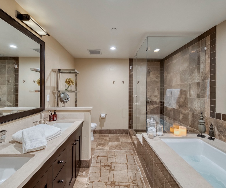 Bedroom 1, Main Level - Primary bedroom ensuite spa-style tub and walk-in shower