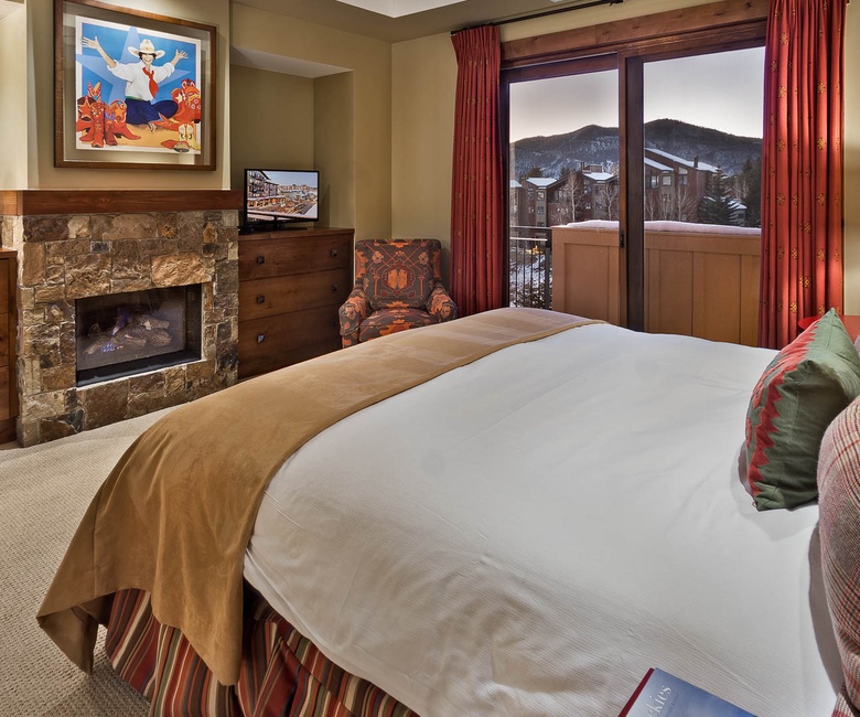 Bedroom 1, Main Level - Primary king suite with fireplace and TV