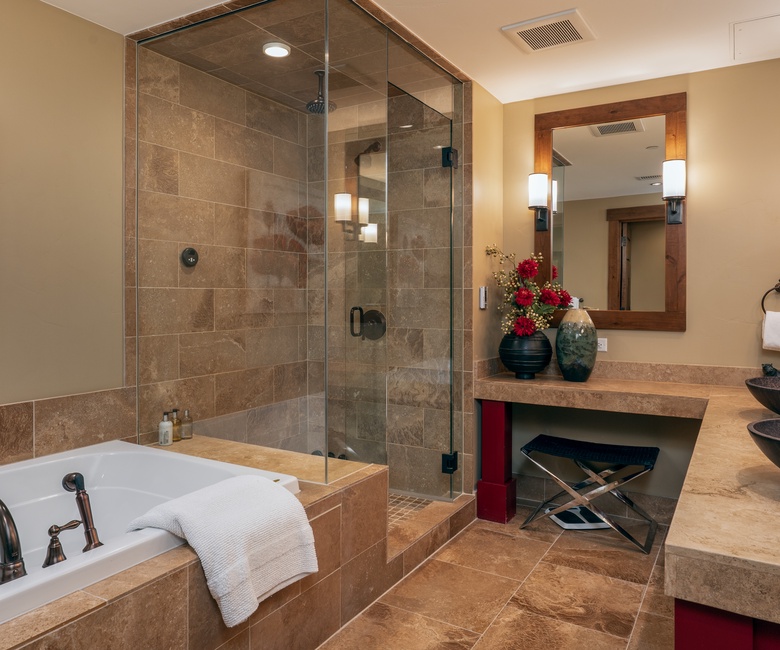 Bedroom 1, Main Level - Primary ensuite with soaking tub and walk-in shower