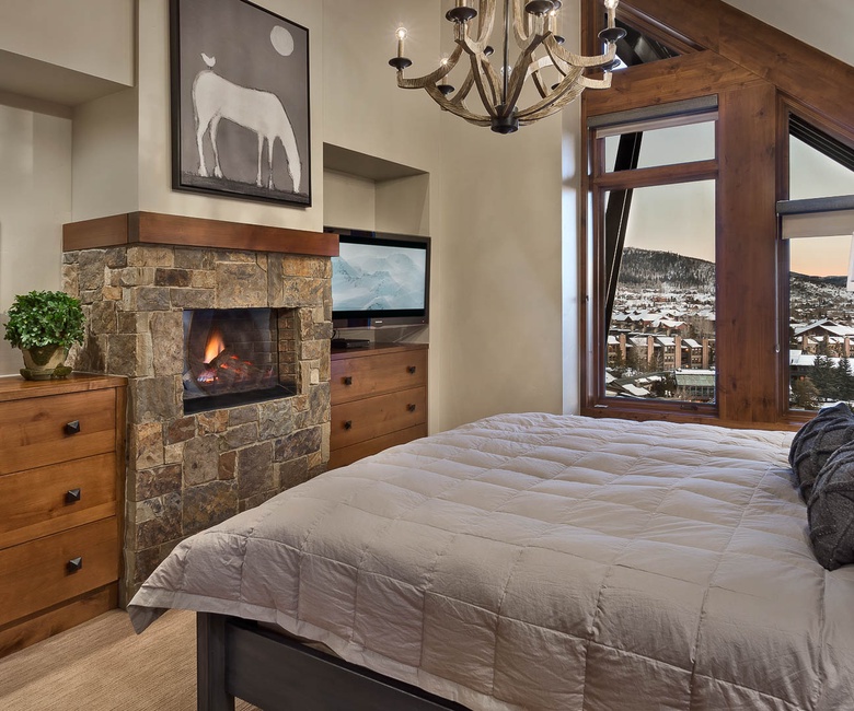 Bedroom 1, Main Level - Primary suite with fireplace and TV