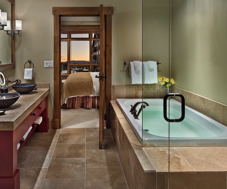 Bedroom 1, Main Level - Primary ensuite with soaking tub and walk-in shower