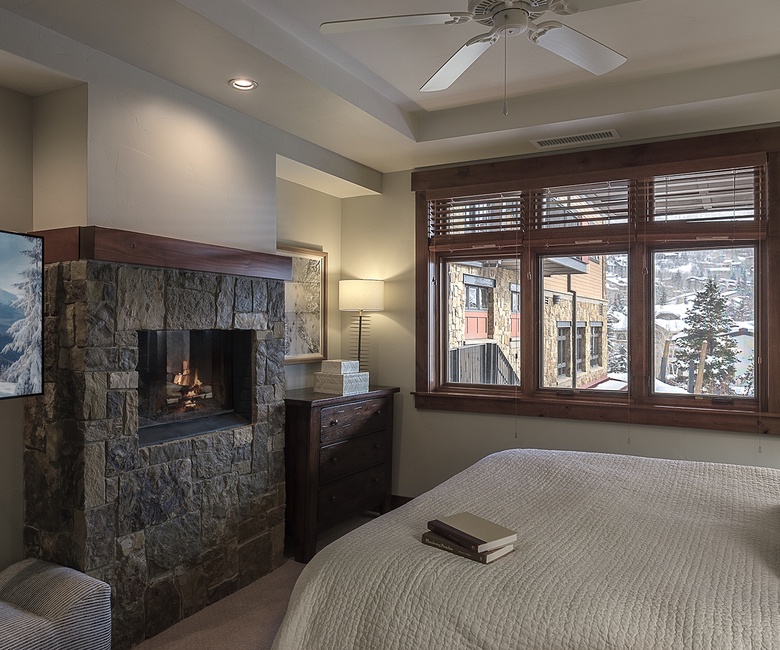 Bedroom 1, Main Level - Primary bedroom suite with king bed and fireplace