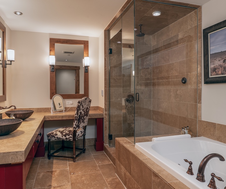 Bedroom 1, Main Level - Primary ensuite with soaking tub and walk-in shower