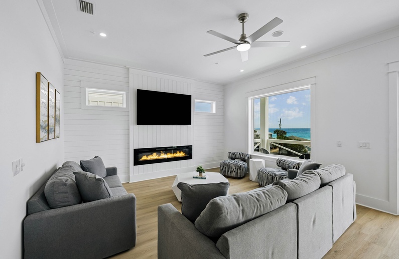 Spacious & Inviting Living Area Offering An Electric Fireplace