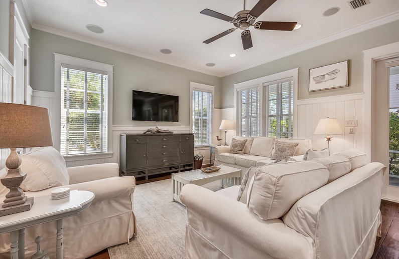 Plush seating, large TV, and seamless flow to the porch for relaxed family time.