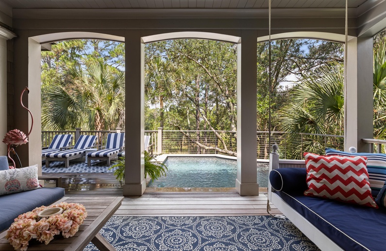 View of pool from covered deck