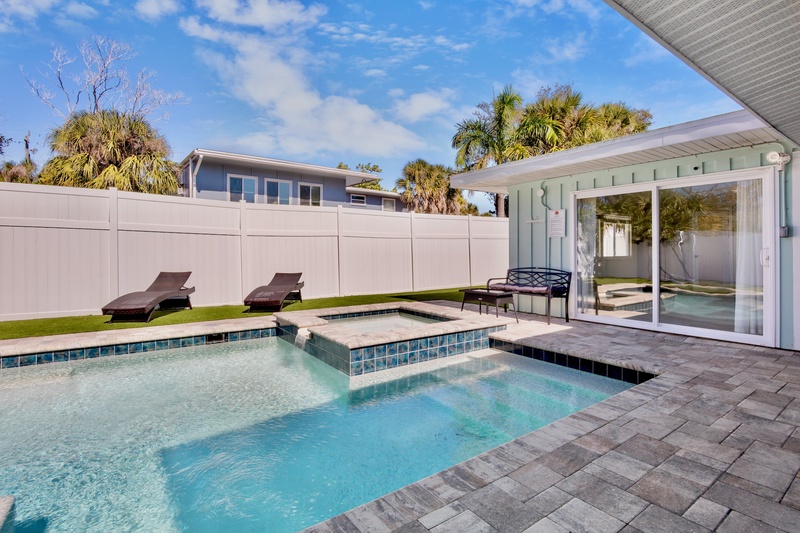 Private Pool, Spa, and Lounge with lush landscaping
